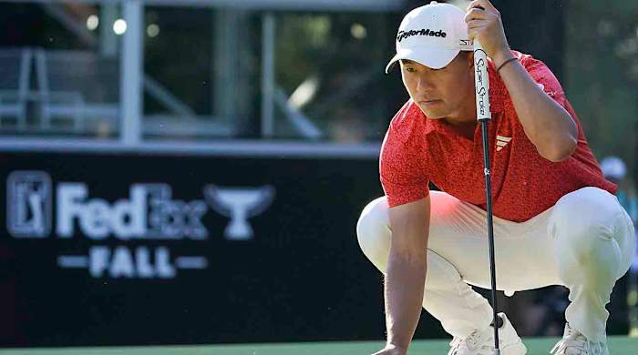 Collin Morikawa prepares to putt on the 17th green in the final round of the 2023 Zozo Championship in Japan.